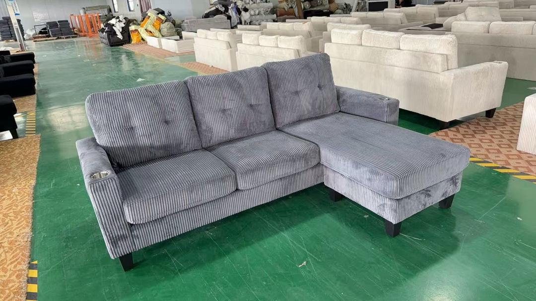 Full view of the Reversible Corduroy 3-Seater Sectional Sofa, showing the compact L-shape configuration and the center backrest folded down to reveal cupholders.