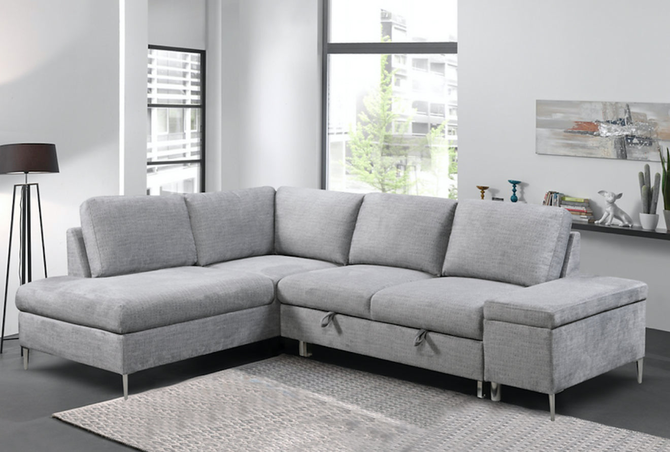 Close-up detail of the Hamilton Sectional's storage ottoman with the lid lifted, revealing the ample internal storage space and linen texture.