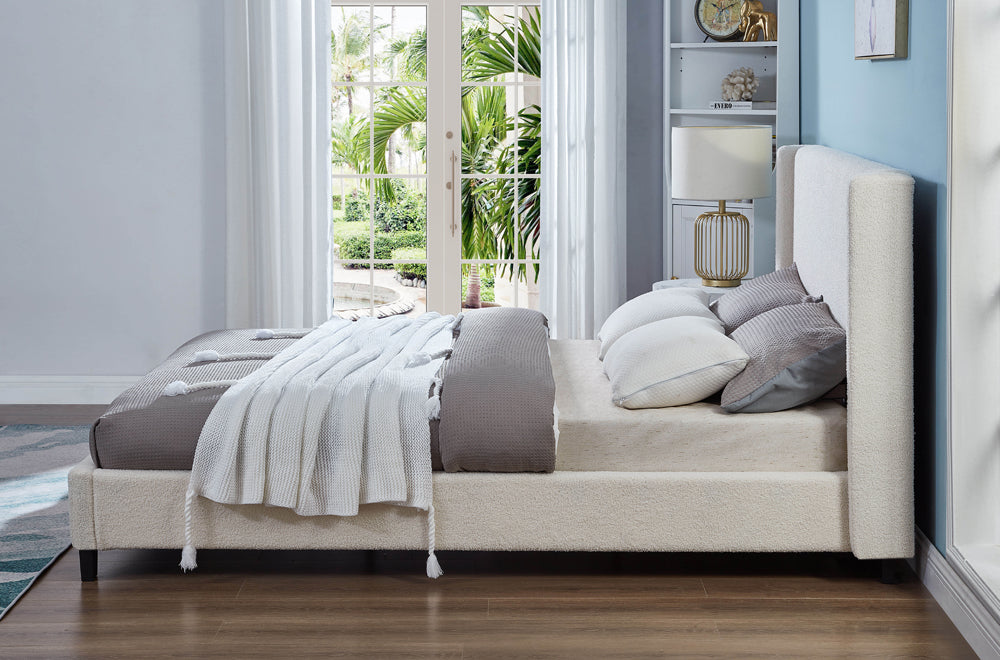 Luxurious modern platform bed with soft boucle fabric and stylish winged headboard design