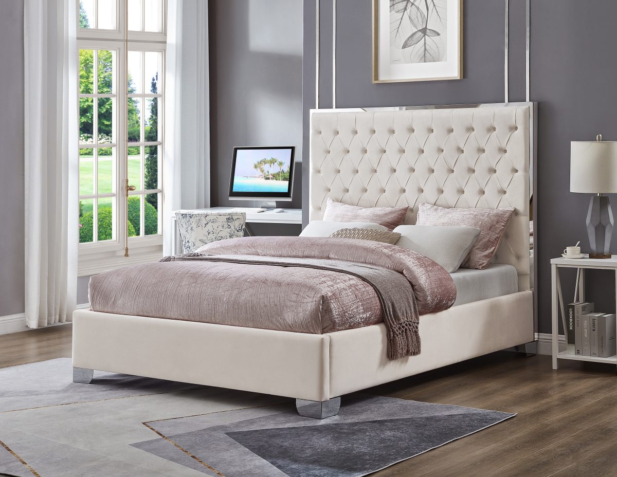 Detailed view of the platform bed's sturdy chrome legs and polished chrome trim on the upholstered frame.
