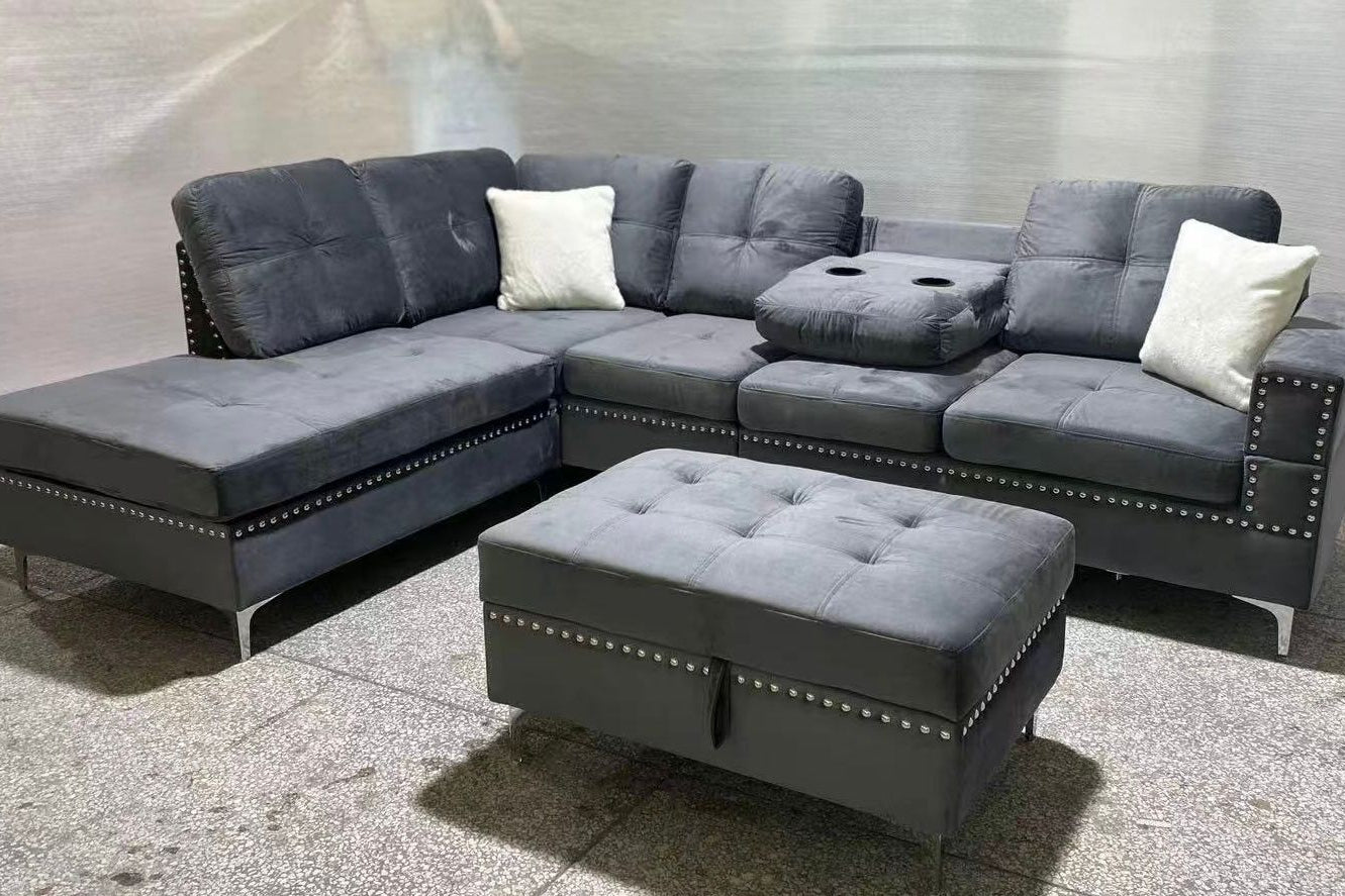 Full view of the Velvet Reversible Sectional Sofa, showcasing the storage ottoman and the center backrest folded down to reveal the integrated cup holders.