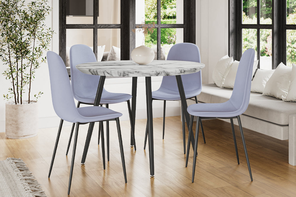 Detailed shot of a single dining chair, emphasizing the rich, soft texture of the velvet upholstery and the chair's comfortable, curved profile.