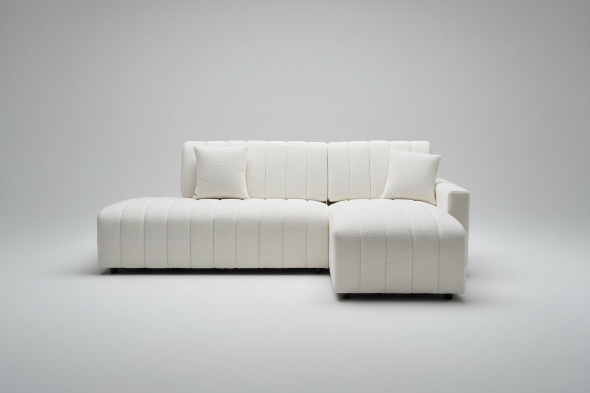 A cozy 4-seater sectional sofa upholstered in a creamy white or neutral textured boucle material, highlighting its soft texture and compact size.