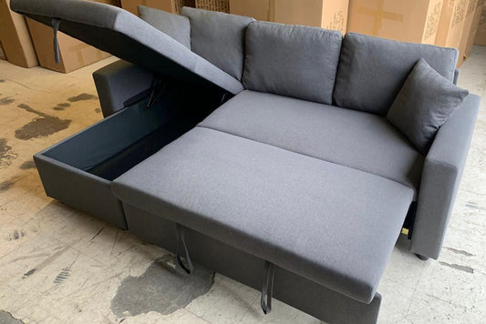 Full view of the 88-Inch Grey Fabric Sectional Sofa with the pull-out bed fully extended, showing the spacious sleeping surface for guests.