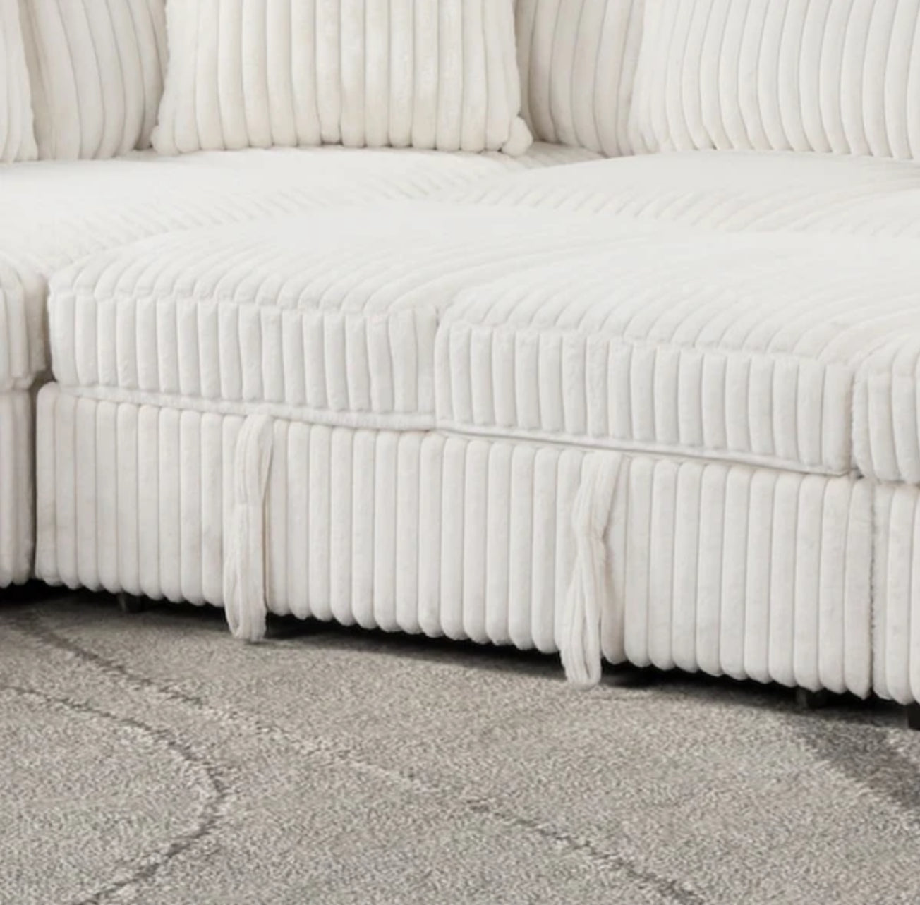 Dedicated view of the integrated USB charging ports on the Becky Sectional, showing a device plugged in for convenient charging.