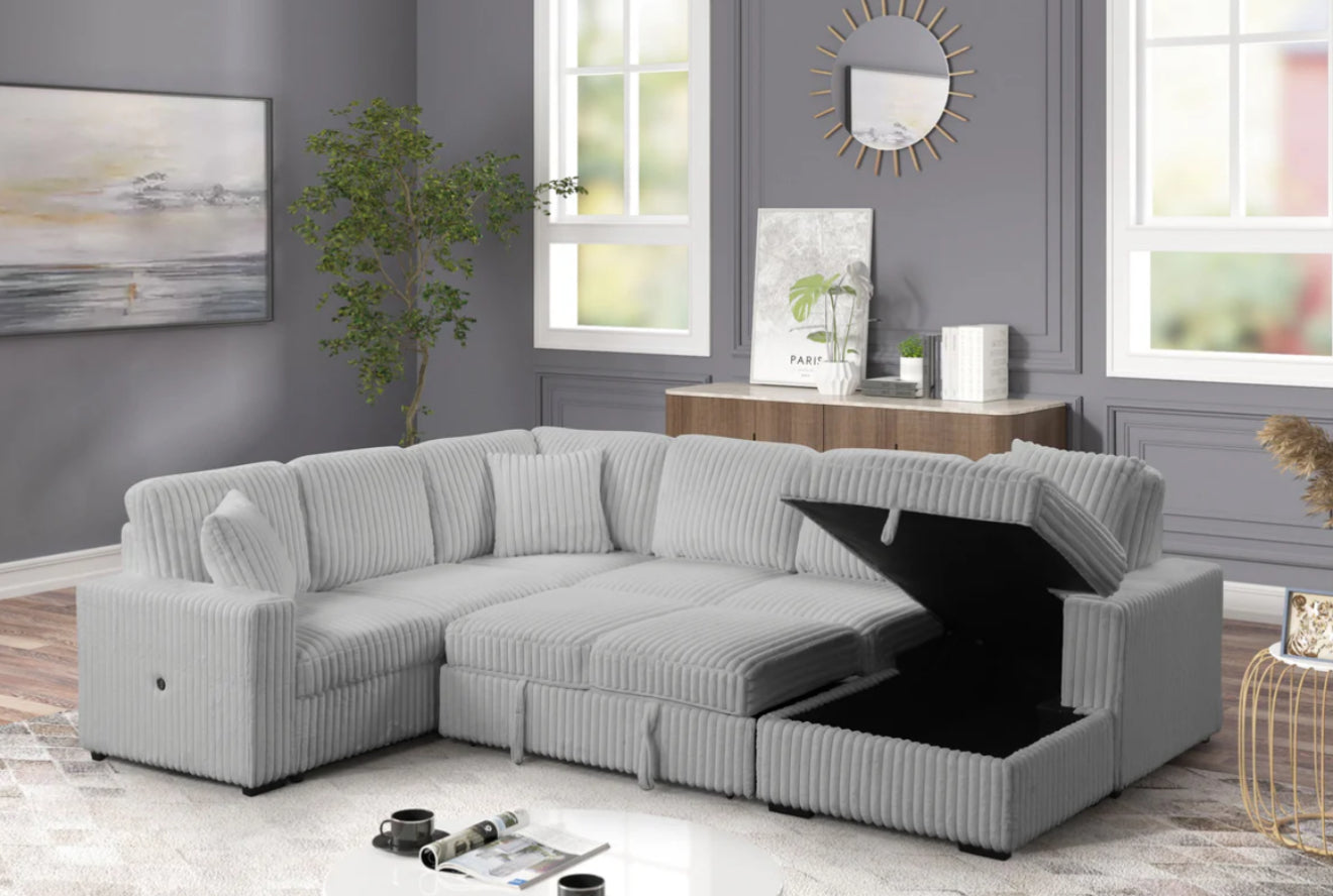 Side profile view of the Becky Sectional Sofa, highlighting the shape of the armrests and the overall contemporary design aesthetic.