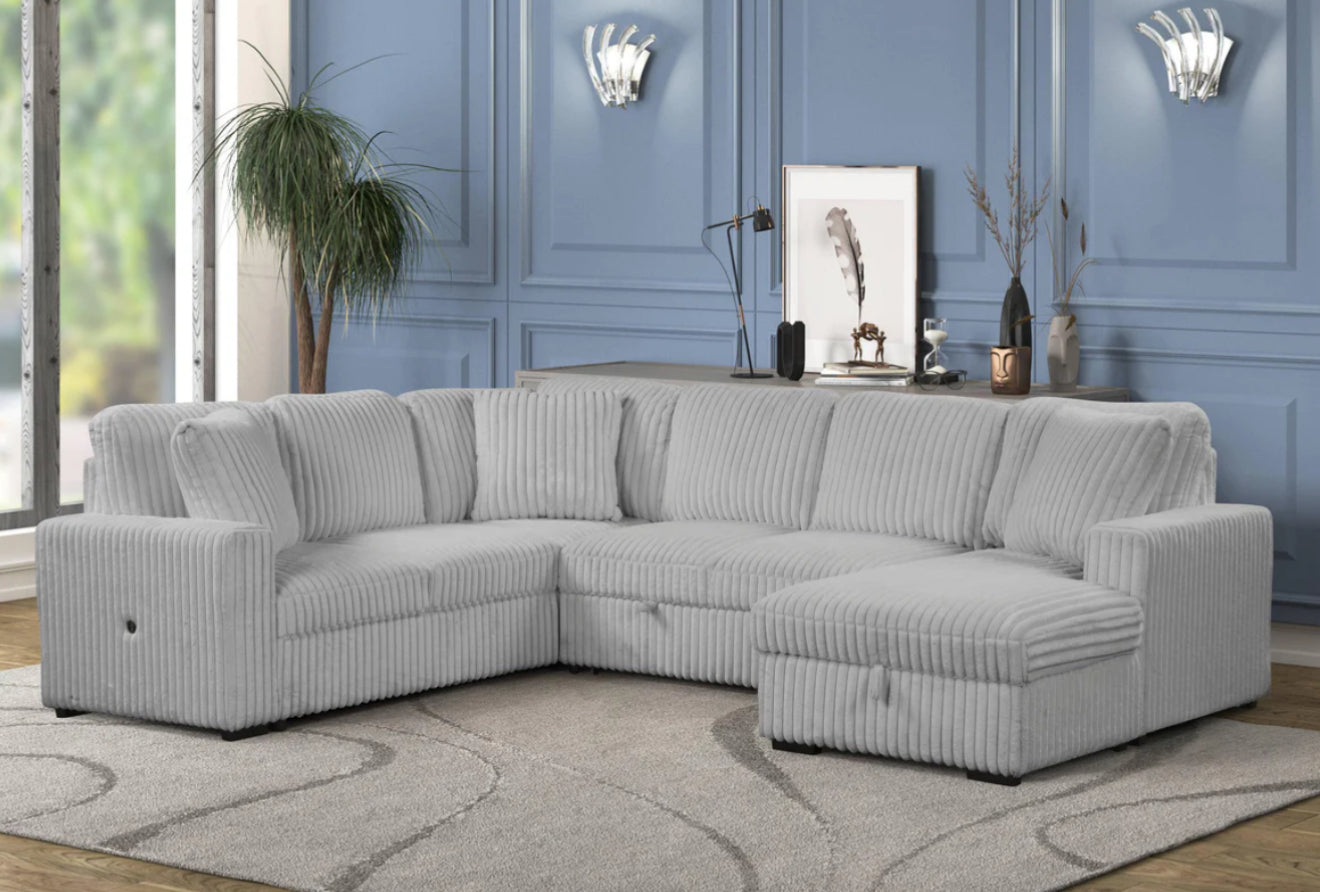 Lifestyle view of the Becky Corduroy Sleeper Sectional arranged in a modern living room setting, demonstrating its stylish fit and size.