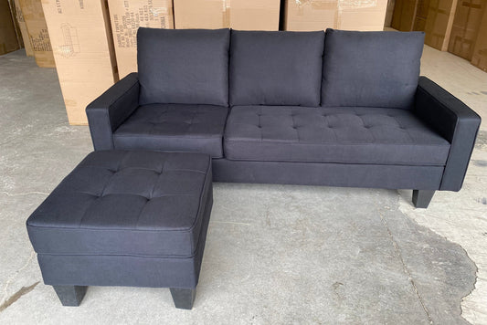 Full view of the Reversible Black Fabric Sectional Sofa, showcasing the compact L-shape configuration and the plush, soft cushions.