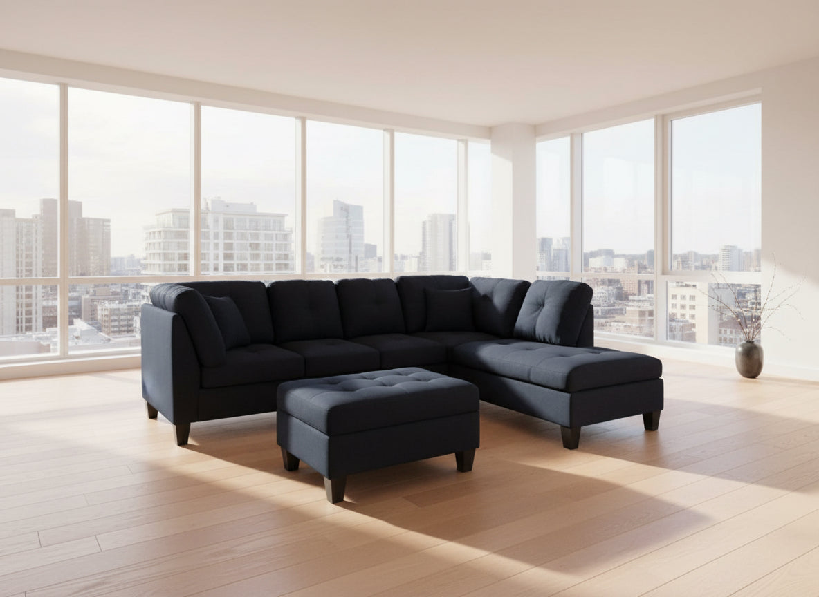Full view of the Black Fabric Reversible Sectional Sofa, showcasing the L-shape configuration and the matching storage ottoman placed at the end.
