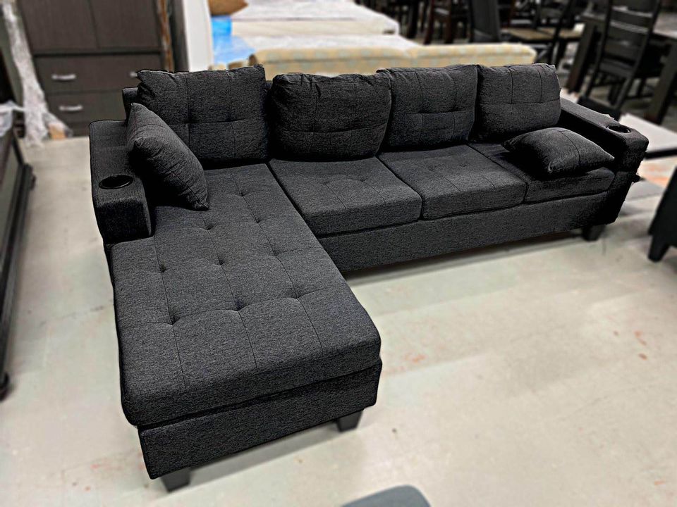 Close-up view of the sectional, highlighting the durable, woven texture of the Black Linen fabric.