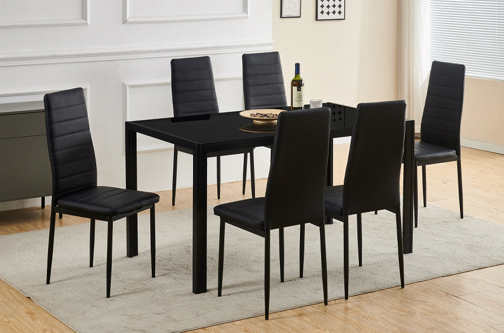 Full view of the Black Metal Modern Dining Table and six chairs upholstered in black Leatherette, showcasing the sleek, minimalist design.