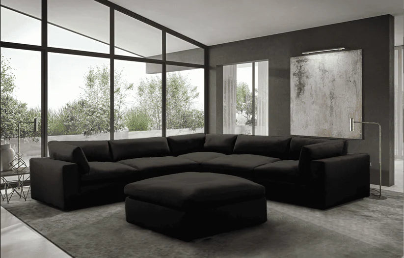 Stylish black reversible sectional sofa with chaise and pull-out bed, ideal for Toronto condos and living rooms.