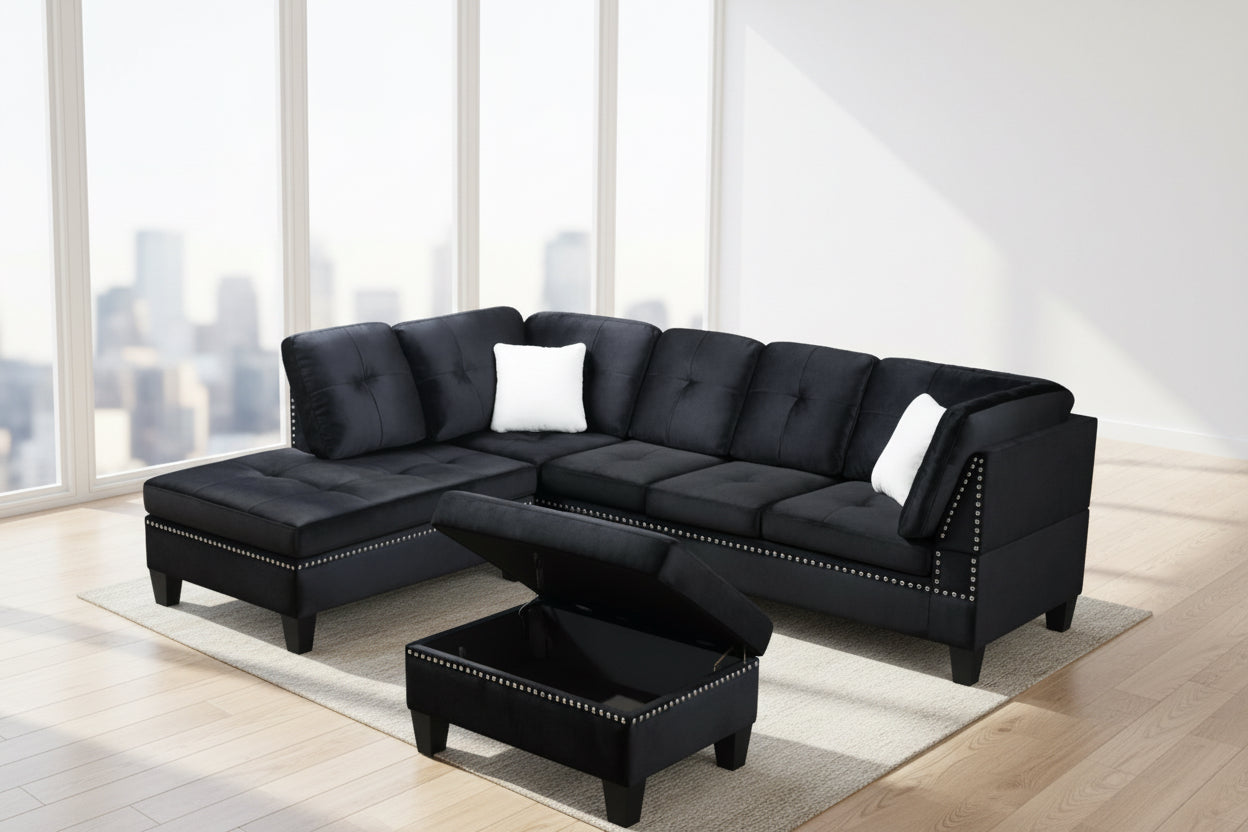 Full view of the Black Velvet Reversible Sectional Sofa, showcasing the rich, plush fabric and the matching storage ottoman placed next to the chaise.