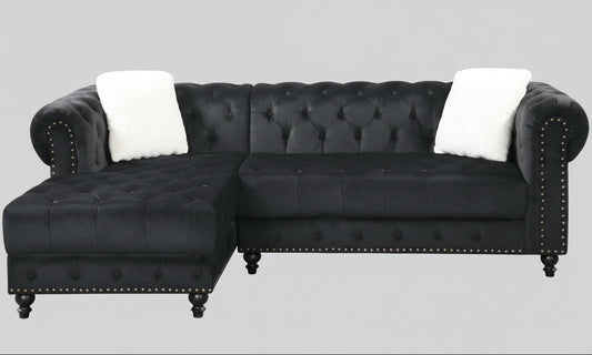 Full view of the Black Velvet Reversible Sectional Sofa, showcasing the plush fabric, L-shape design, and the elegant diamond tufting on the back cushions.