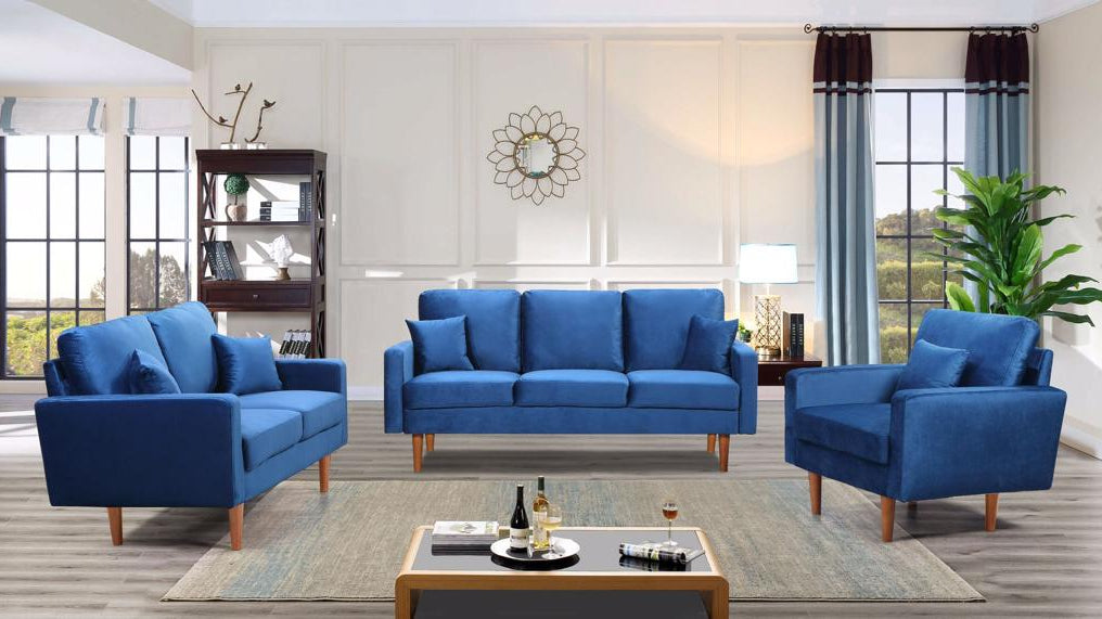 Full view of the Blue Velvet 3-Piece Set, showcasing the sofa, loveseat, and chair with soft pillow-back cushions in a coordinated arrangement.