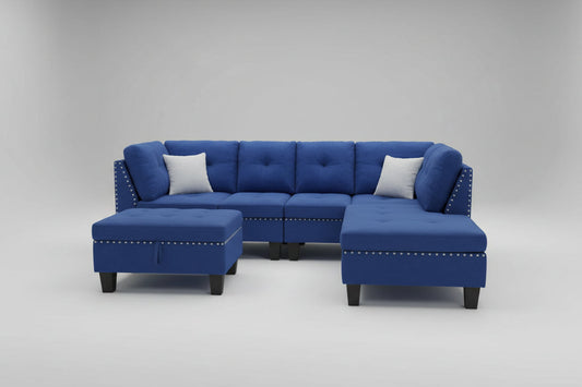 Full view of the Blue Velvet Reversible Sectional Sofa, showcasing the rich, plush fabric and the matching storage ottoman placed next to the chaise.
