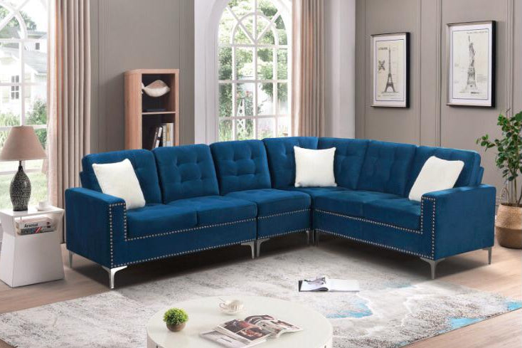Full view of the Blue Velvet Fabric Sectional Sofa, showcasing the rich, plush upholstery, included accent pillows, and the sleek chrome legs.