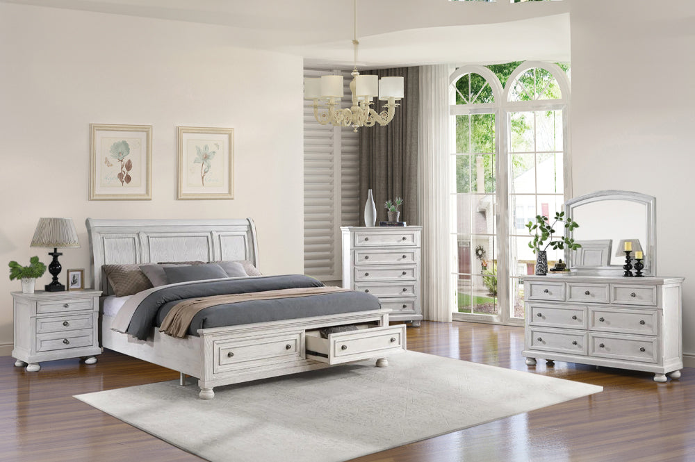 Charley Sleigh Bedroom Set in a beautiful Antique White color, featuring the storage bed, dresser, and mirror.