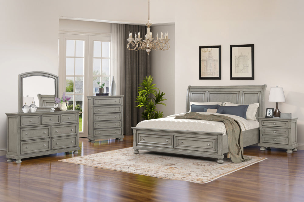 Full view of the Charley Grey Sleigh Bedroom Set, showing the curved sleigh bed with footboard storage drawers, dresser, mirror, and nightstand.