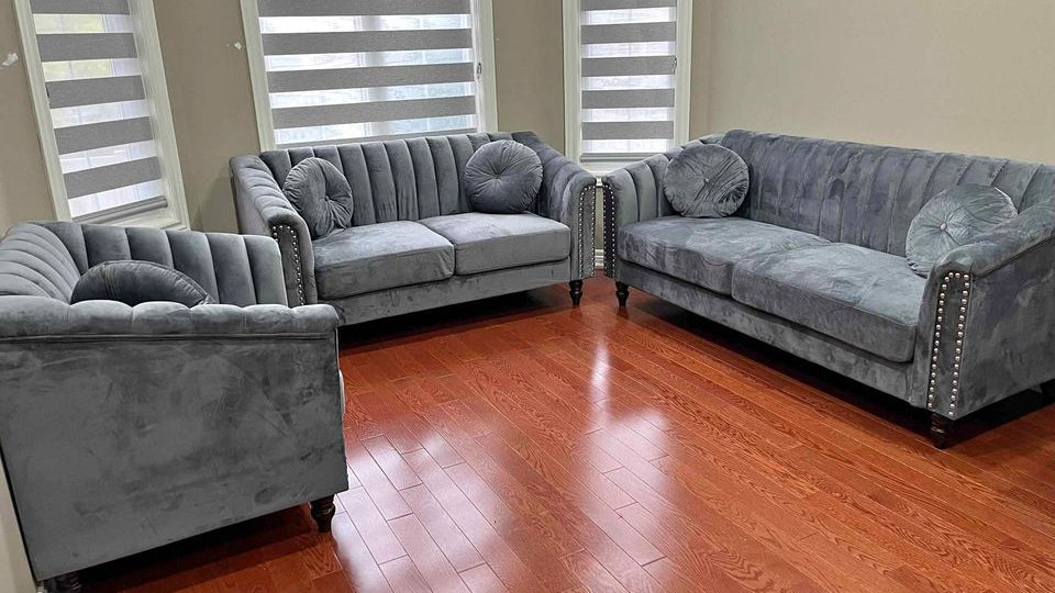 Full view of the Dark Grey Velvet 3-Piece Set, showcasing the deep color and luxurious texture of the sofa, loveseat, and chair in a coordinated space.