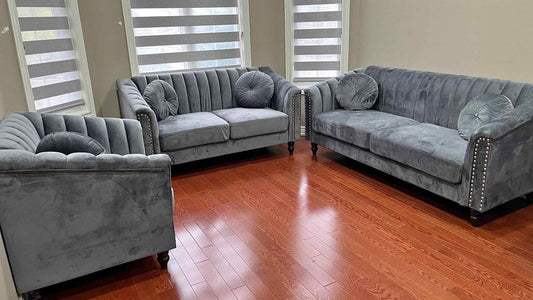 Full view of the Dark Grey Velvet 3-Piece Set, showcasing the deep color and luxurious texture of the sofa, loveseat, and chair in a coordinated space.