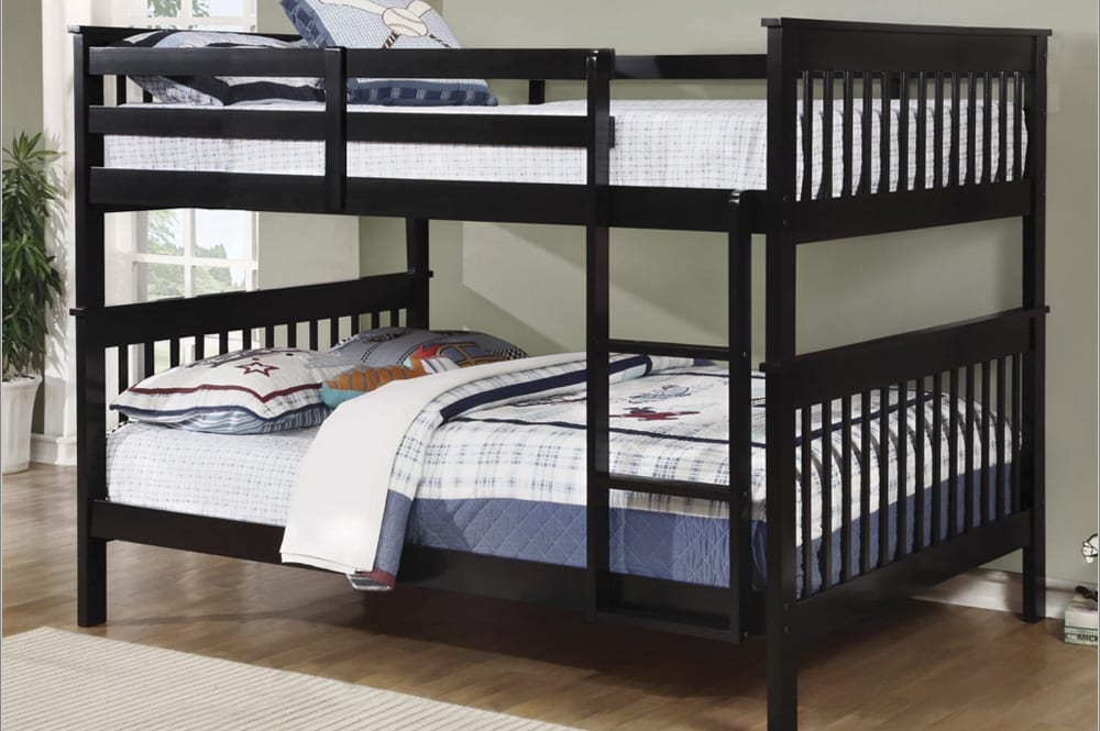 Solid pine double over double bunk bed, showing the integrated ladder, full guardrails, and large sleeping capacity.
