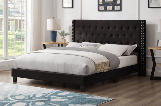 Elegant upholstered platform bed with nailhead trim and button tufting in black velvet
