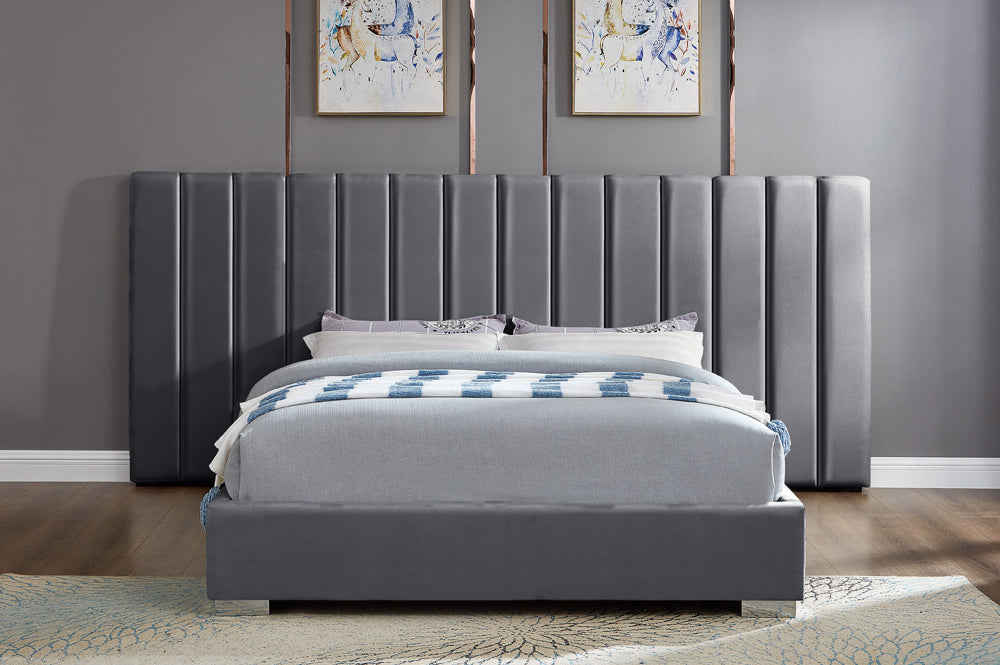 Glamorous velvet bed with extended panel headboard and sleek contemporary styling
