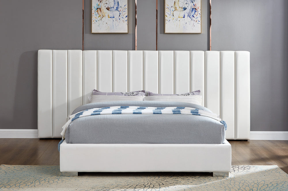 Elegant modern platform bed with plush velvet upholstery and extended headboard design

