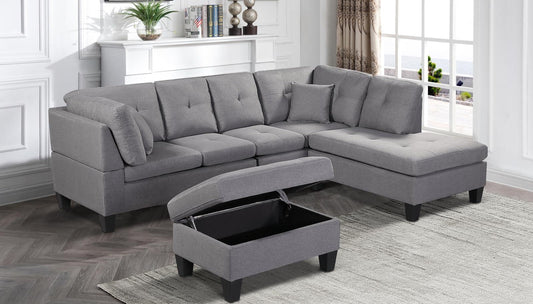 Full view of the Fabric Reversible Sectional Sofa, showing the included accent pillows and the matching storage ottoman placed next to the chaise.