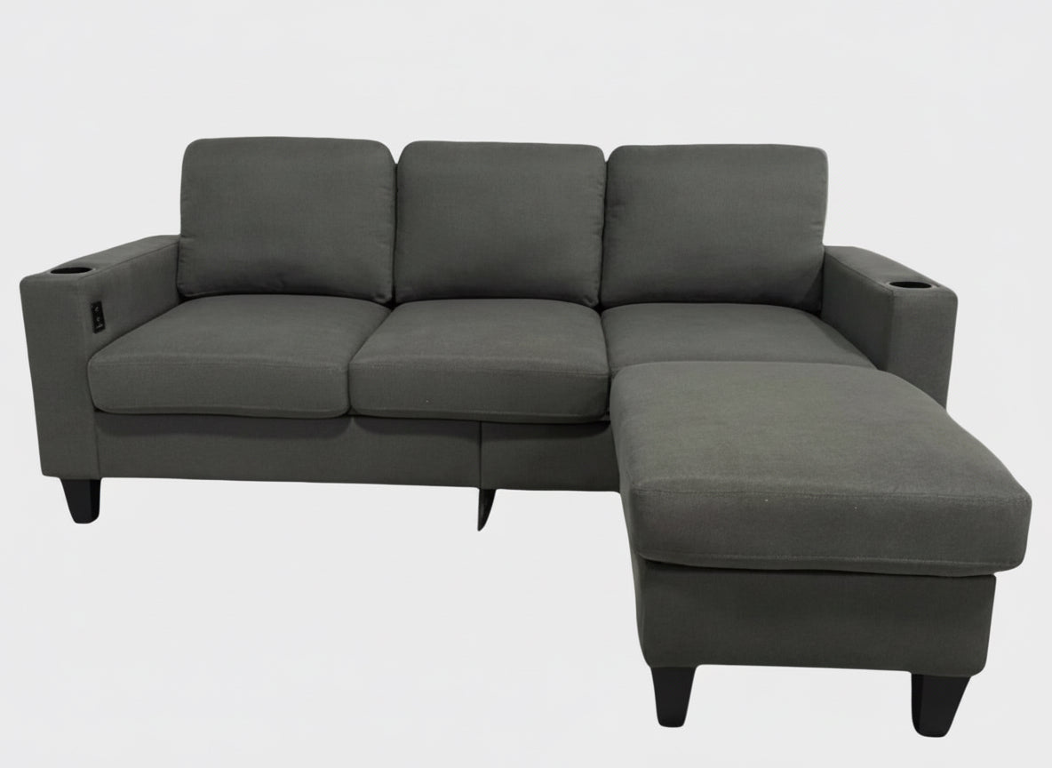 Full view of the Reversible Fabric Sectional Sofa, showing the L-shape configuration and the center console with cupholders.