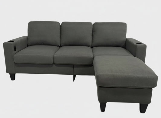 Full view of the Reversible Fabric Sectional Sofa, showing the L-shape configuration and the center console with cupholders.