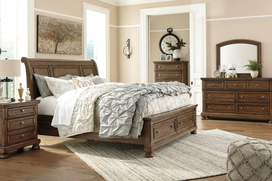 Full view of the Flynnter Sleigh Bed in Medium Brown, showcasing the curved headboard and footboard with two integrated storage drawers.