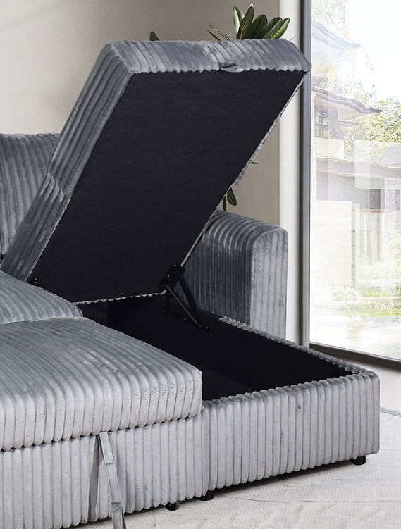 Angled view illustrating the smooth pull-out bed mechanism of the Grey Corduroy sectional, emphasizing the easy conversion to a bed.