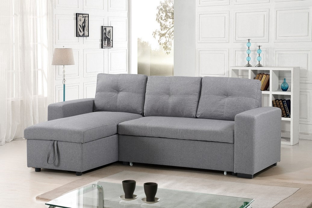 Full view of the Grey Fabric Reversible Sectional Sofa, showcasing the flexible chaise and the pull-out sleeper function extended.