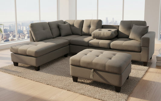 Full view of the Grey Fabric Reversible Sectional Sofa, showcasing the storage ottoman and the center backrest folded down to reveal the integrated cup holders.