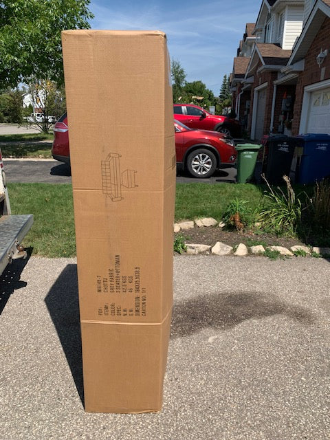 Close-up view of the center backrest folded down, clearly showcasing the integrated cup holders and the texture of the Grey Linen fabric.