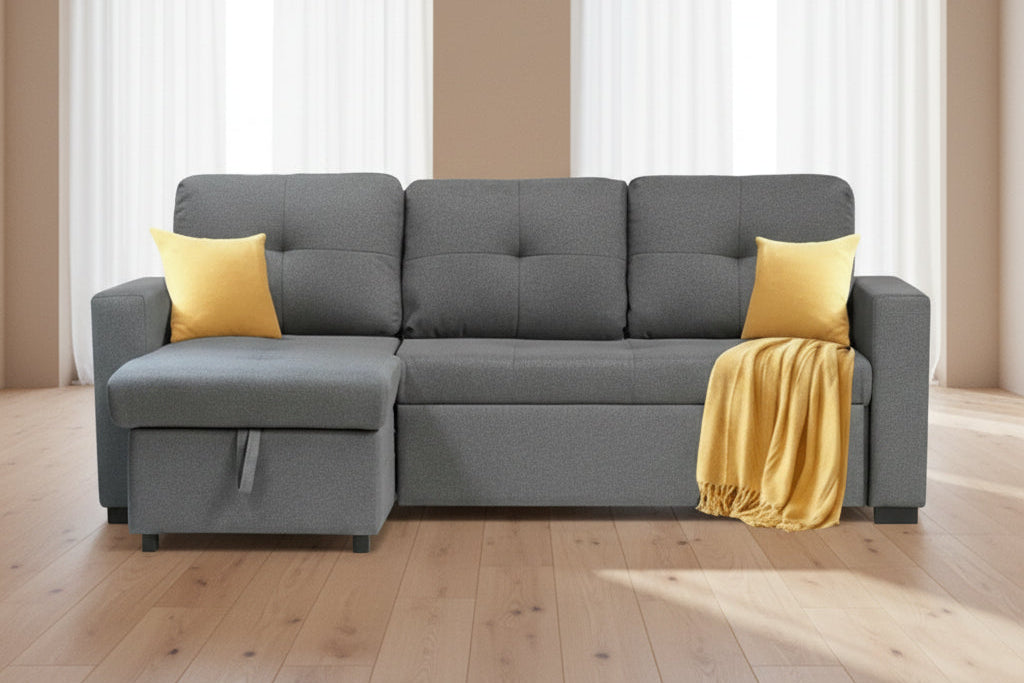 Full view of the Grey Fabric Reversible Sectional Sofa, showcasing the storage chaise and the pull-out sleeper function ready for use.