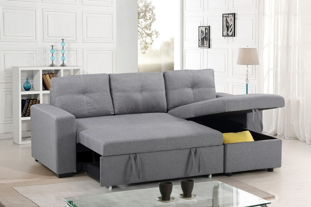 Close-up detail illustrating the smooth pull-out bed mechanism of the Grey Fabric sectional, emphasizing the easy transition to a bed.