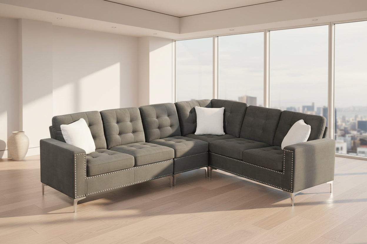Full view of the Grey Velvet Fabric Sectional Sofa, showcasing the rich, plush upholstery, three included accent pillows, and the sleek chrome legs.