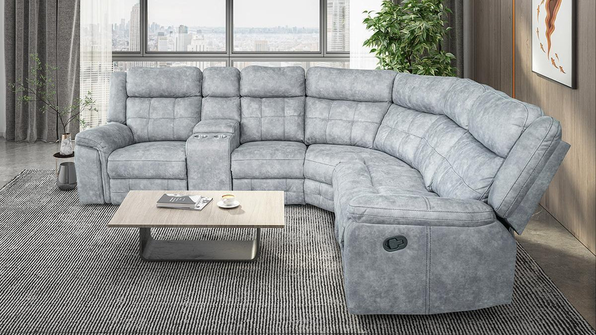 Angled view of the Ivan Recliner Sectional with one of the manual reclining seats activated, emphasizing the cozy grey fabric and deep seating.
