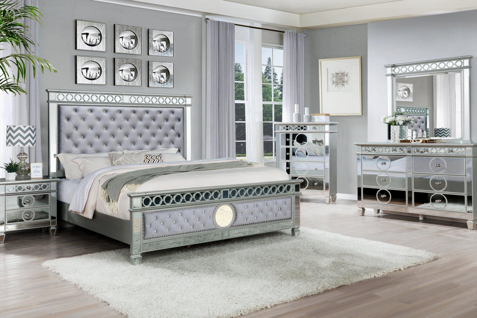Full view of the James Gray Silver Velvet Upholstered Panel Bedroom Set, showcasing the tall upholstered headboard, dresser, and mirror.