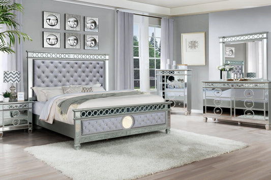 Full view of the James Gray Silver Velvet Upholstered Panel Bedroom Set, showcasing the tall upholstered headboard, dresser, and mirror.