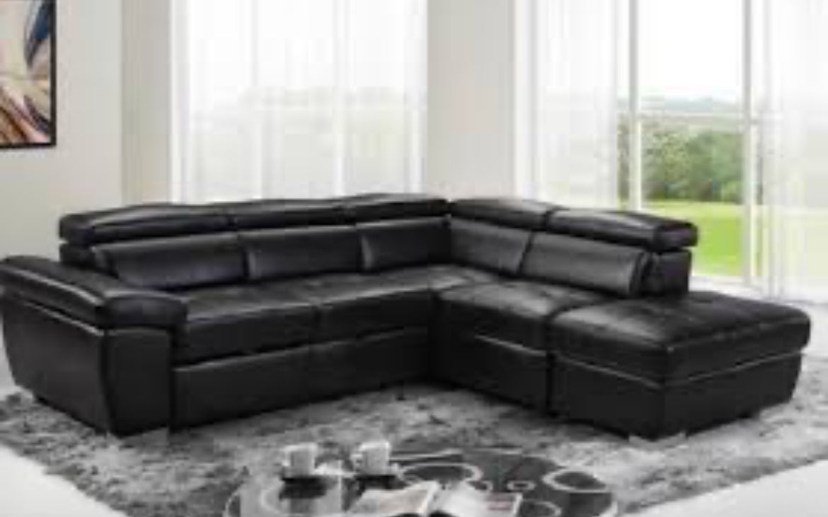 Close-up detail of the Lauren Sectional, highlighting the movement and mechanism of the adjustable headrests for customizable comfort.