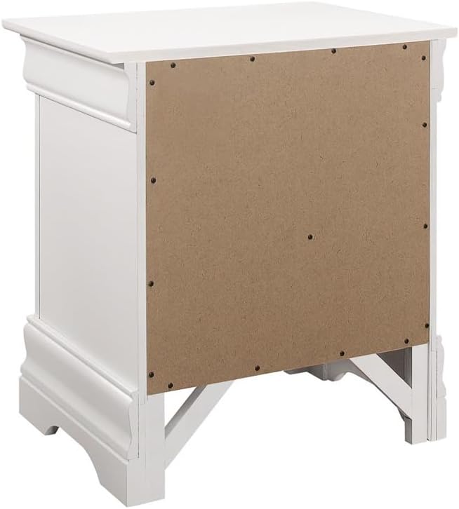 Detailed view of the graceful curves and solid wood construction of the white Louis Philippe sleigh bed footboard.