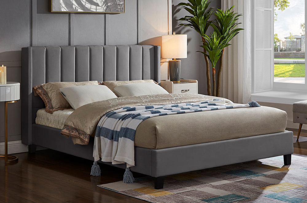 Contemporary velvet platform bed featuring panel tufted headboard and sturdy wooden slat base
