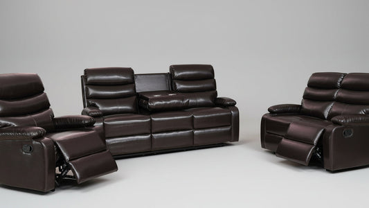 Full view of the Oliver Brown SLC Leather Manual Recliner 3-Piece Set, showing the sofa, loveseat, and chair with one piece in the reclined position.