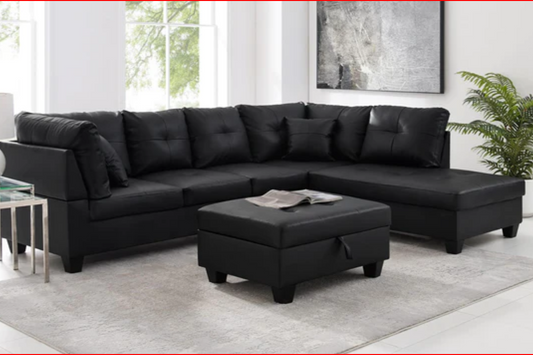 Full view of the PU Leather Sectional Sofa, showcasing the sleek upholstery, the fixed Left-Hand Chaise, and the matching storage ottoman.