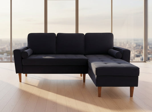 Full view of the Reversible Black Velvet Fabric Sectional Sofa, showcasing the rich, plush velvet texture and the L-shape configuration with chaise.