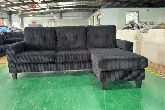Full view of the Reversible Corduroy 3-Seater Sectional Sofa, showing the ribbed corduroy texture and the L-shape configuration with center cupholders.